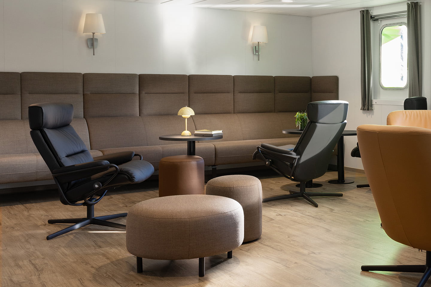 Lounge area onboard a Vard vessel filled with Stressless furniture