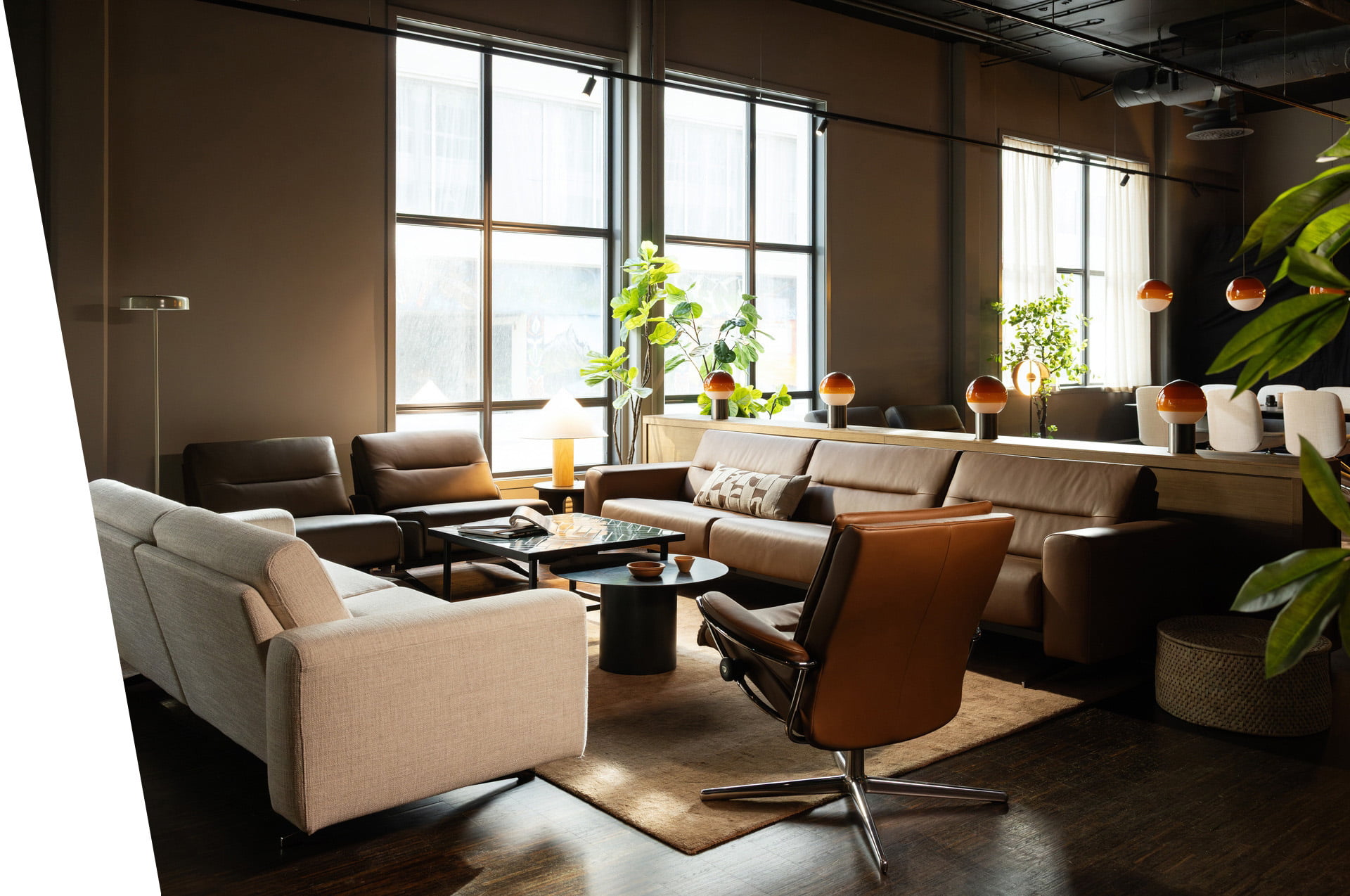 Stressless sofas and recliners in a lounge area
