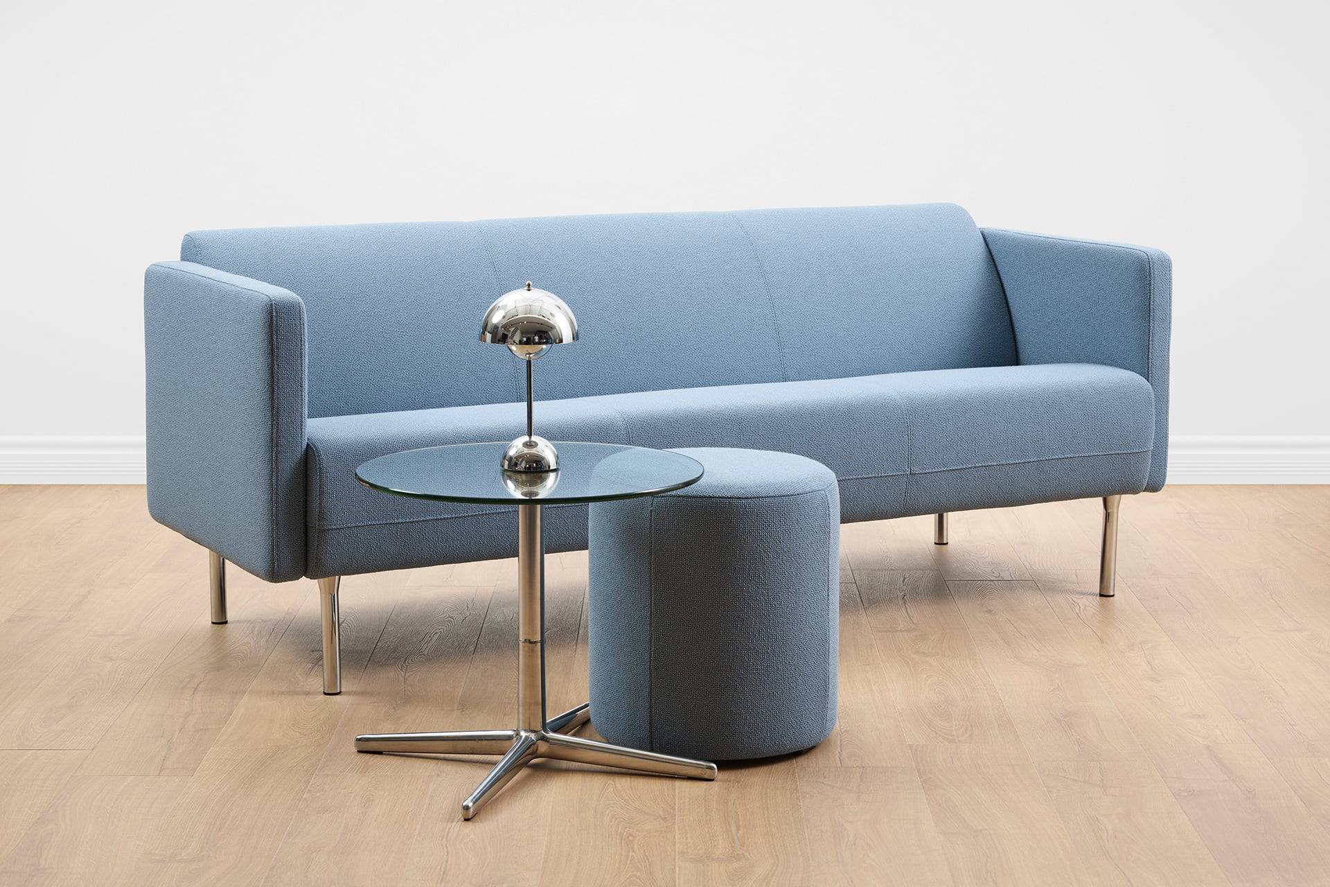 Ekornes Frende Blue sofa with a pouf