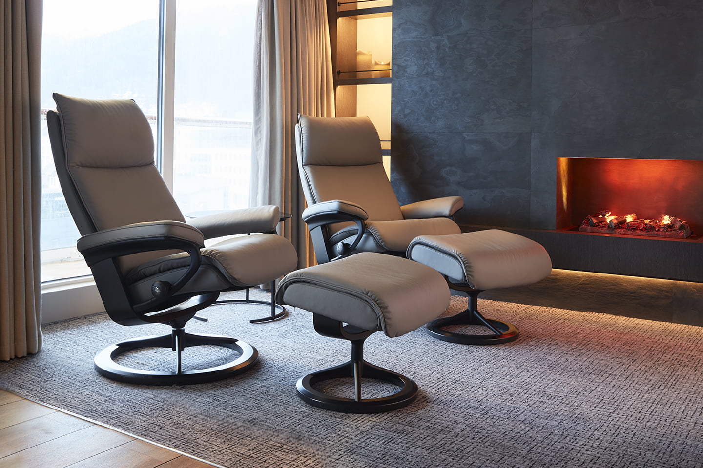 Stressless® recliners in front of fireplace in Havila Capella